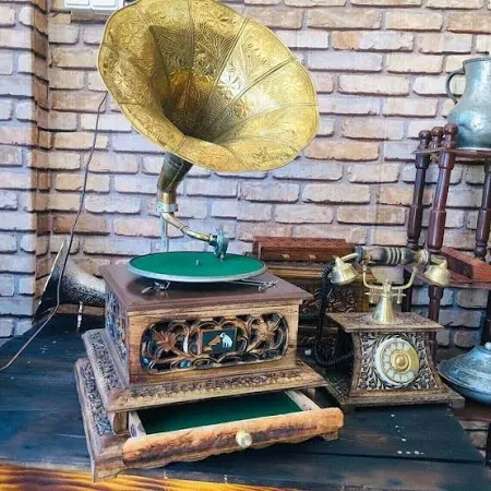 Wooden gramophone with wind-up mechanism
